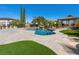 Gorgeous backyard with a freeform pool, gazebo, manicured landscaping and travertine decking at 11504 White Cliffs Ave, Las Vegas, NV 89138