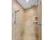 Tiled shower with two shower heads and a built-in bench for added convenience at 11504 White Cliffs Ave, Las Vegas, NV 89138