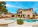 Backyard with a private pool and outdoor entertaining space at 1584 Bermuda Dunes Dr, Boulder City, NV 89005