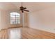 Spacious bedroom features hardwood floors, a large window, and ample natural light at 1584 Bermuda Dunes Dr, Boulder City, NV 89005