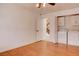 Bedroom featuring laundry in closet, laminated wood floor, and view to stairs at 1584 Bermuda Dunes Dr, Boulder City, NV 89005