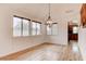 Dining room with hardwood floors, large windows offering great natural lighting, and a modern light fixture at 1584 Bermuda Dunes Dr, Boulder City, NV 89005