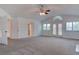 Spacious living room featuring vaulted ceilings, fireplace, and access to other rooms at 1584 Bermuda Dunes Dr, Boulder City, NV 89005