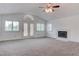Bright living room with vaulted ceiling, fireplace, and shuttered windows for natural light at 1584 Bermuda Dunes Dr, Boulder City, NV 89005