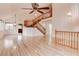 Open-concept living area featuring hardwood floors, a staircase, and abundant natural light at 1584 Bermuda Dunes Dr, Boulder City, NV 89005
