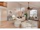 Bright living room with vaulted ceilings, large windows, and stylish furnishings, perfect for entertaining at 1584 Bermuda Dunes Dr, Boulder City, NV 89005