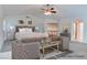 Staged bedroom with sitting area, vaulted ceiling, and ensuite access at 1584 Bermuda Dunes Dr, Boulder City, NV 89005