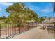 Inviting patio with seating area overlooking a lush, mature landscape at 1584 Bermuda Dunes Dr, Boulder City, NV 89005