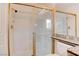 Bathroom features a walk-in shower with glass doors and granite countertop at 1584 Bermuda Dunes Dr, Boulder City, NV 89005