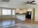 Bright kitchen featuring white cabinets, granite countertops, and modern appliances in an open-concept layout at 1681 Appaloosa Ln, Pahrump, NV 89060