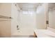 Bathroom showcasing a tub/shower combination with a white tile surround at 204 Mchenry St, Las Vegas, NV 89144