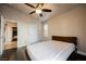 This bedroom features wood-look floors, a ceiling fan and neutral walls at 204 Mchenry St, Las Vegas, NV 89144