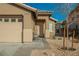 Inviting single story home features a two car garage and low maintenance desert landscaping at 204 Mchenry St, Las Vegas, NV 89144