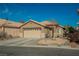 Inviting single story home features a two car garage and low maintenance desert landscaping at 204 Mchenry St, Las Vegas, NV 89144