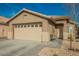 Inviting single story home features a two car garage and low maintenance desert landscaping at 204 Mchenry St, Las Vegas, NV 89144