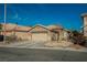Inviting single story home features a two car garage and low maintenance desert landscaping at 204 Mchenry St, Las Vegas, NV 89144