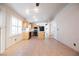 Bright kitchen with a seamless flow into the dining and living areas, featuring an island and modern appliances at 204 Mchenry St, Las Vegas, NV 89144
