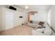 Bright living room with neutral colors, tile floors, large windows, and a comfortable sectional sofa at 204 Mchenry St, Las Vegas, NV 89144