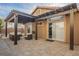 Outdoor patio with a pergola, light pavers, and comfortable seating perfect for relaxation and entertaining guests at 204 Mchenry St, Las Vegas, NV 89144