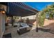 Relaxing covered patio featuring comfortable wicker furniture and desert landscaping at 204 Mchenry St, Las Vegas, NV 89144