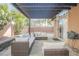 Inviting outdoor patio with a pergola, attractive pavers, and relaxing seating, perfect for entertaining guests at 204 Mchenry St, Las Vegas, NV 89144