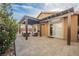 Charming outdoor patio featuring a pergola, neutral pavers, and cozy seating, ideal for enjoying the fresh air at 204 Mchenry St, Las Vegas, NV 89144