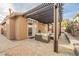 Inviting outdoor patio with a pergola, pavers, and comfortable seating, creating a relaxing space for outdoor enjoyment at 204 Mchenry St, Las Vegas, NV 89144