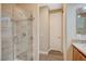 Beautiful bathroom featuring a glass enclosed shower and a vanity with ample counter space at 2503 Kaymin Ridge Rd, Henderson, NV 89052