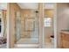 Modern bathroom showcases a glass-enclosed shower with decorative tile and a separate toilet room at 2503 Kaymin Ridge Rd, Henderson, NV 89052