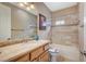 Well-lit bathroom features a soaking tub, granite vanity and tile backsplash, providing a luxurious space at 2503 Kaymin Ridge Rd, Henderson, NV 89052