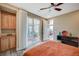 Comfortable bedroom with a ceiling fan, sliding glass door to the patio, and built in cabinetry at 2503 Kaymin Ridge Rd, Henderson, NV 89052