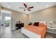 Bright bedroom with a ceiling fan, a sliding glass door to exterior spaces, and hardwood flooring at 2503 Kaymin Ridge Rd, Henderson, NV 89052
