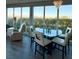 Dining room with contemporary chandelier and floor to ceiling windows at 2503 Kaymin Ridge Rd, Henderson, NV 89052