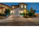 Inviting two-story home boasts a well-manicured yard, attached garage and elegant architecture at 2503 Kaymin Ridge Rd, Henderson, NV 89052