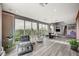 Bright and spacious living room features comfortable seating, modern chandelier, and large windows with amazing views at 2503 Kaymin Ridge Rd, Henderson, NV 89052