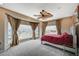 Spacious main bedroom boasts large windows, city views, and a unique ceiling fan at 2503 Kaymin Ridge Rd, Henderson, NV 89052