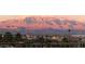 Stunning mountain view at sunset overlooking a well-lit community at 2503 Kaymin Ridge Rd, Henderson, NV 89052