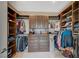 Organized walk-in closet with custom shelving, drawers, and ample storage space for clothing and accessories at 2503 Kaymin Ridge Rd, Henderson, NV 89052