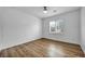 Bedroom with wood flooring, plantation shutters, and ceiling fan at 2535 Jada Dr, Henderson, NV 89044