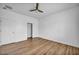 Bedroom featuring wood flooring, ceiling fan, and closet at 2535 Jada Dr, Henderson, NV 89044