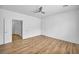Large bedroom with wood-look floors, ceiling fan and neutral paint at 2535 Jada Dr, Henderson, NV 89044