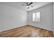 Bedroom with wood flooring, plantation shutters, and ceiling fan at 2535 Jada Dr, Henderson, NV 89044