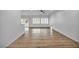 Bright living room features wood flooring, plantation shutters, and a ceiling fan at 2535 Jada Dr, Henderson, NV 89044