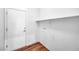 Utility room with white door, neutral paint and wood-look flooring at 2535 Jada Dr, Henderson, NV 89044