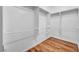 Walk-in closet with shelving and wood-look floors at 2535 Jada Dr, Henderson, NV 89044