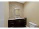 Stylish powder room with granite countertop, mosaic tile, modern sink, and fixtures at 2672 Mystere Ct, Las Vegas, NV 89117