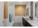 Modern bathroom featuring a glass-enclosed shower, dual sinks, and sleek fixtures for a spa-like experience at 2672 Mystere Ct, Las Vegas, NV 89117