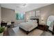 Serene bedroom retreat featuring a comfortable bed, a modern desk, and soft, natural lighting at 2672 Mystere Ct, Las Vegas, NV 89117