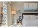 Bedroom with a sliding glass door out to a balcony, lamp, and queen size bed at 2672 Mystere Ct, Las Vegas, NV 89117