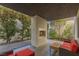 A contemporary outdoor fireplace with seating provides a cozy atmosphere at 2672 Mystere Ct, Las Vegas, NV 89117